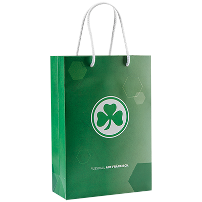 Geschenktüte in Grün mit Farbverlauf und mit Kleeblatt Logo in der Mitte